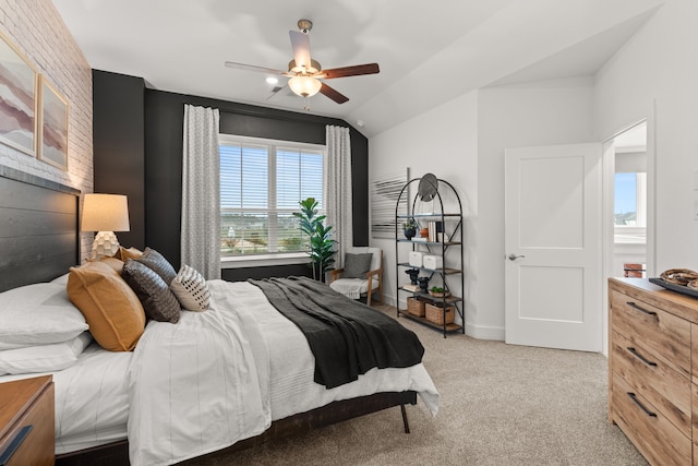 bedroom featuring a ceiling fan, vaulted ceiling, and light colored carpet
