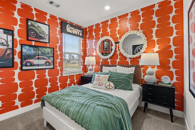 carpeted bedroom with recessed lighting, visible vents, and baseboards