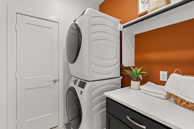 washroom with stacked washer / dryer