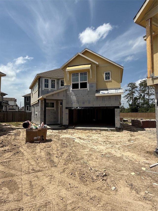 property under construction featuring fence