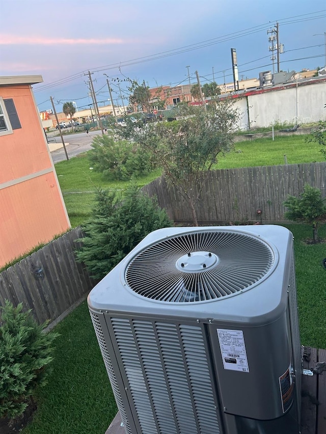 details featuring central AC and fence