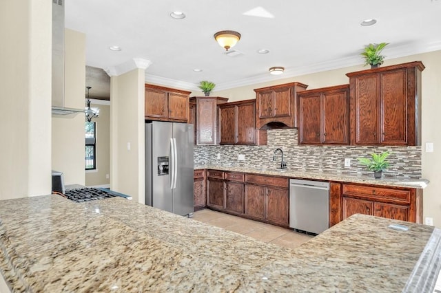 kitchen with light stone countertops, appliances with stainless steel finishes, and decorative backsplash