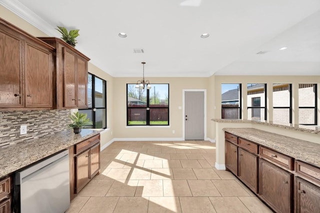 kitchen featuring recessed lighting, an inviting chandelier, tasteful backsplash, and dishwasher
