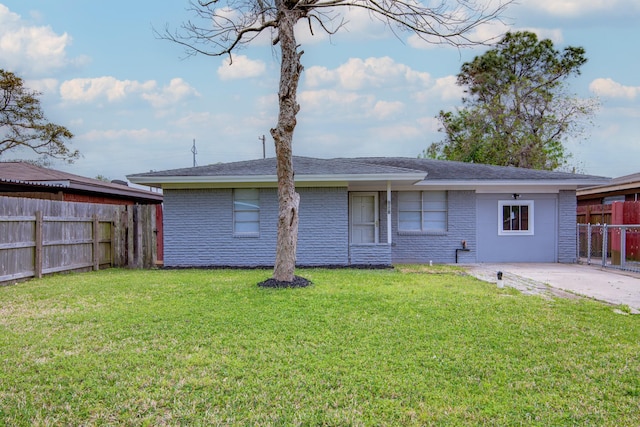 2821 1st Ave N, Texas City, TX 77590 - rear view of property with brick siding, fence, and a lawn