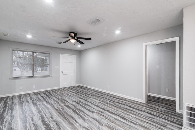 2821 1st Ave N, Texas City, TX 77590 - empty room with baseboards, visible vents, a ceiling fan, and wood finished floors