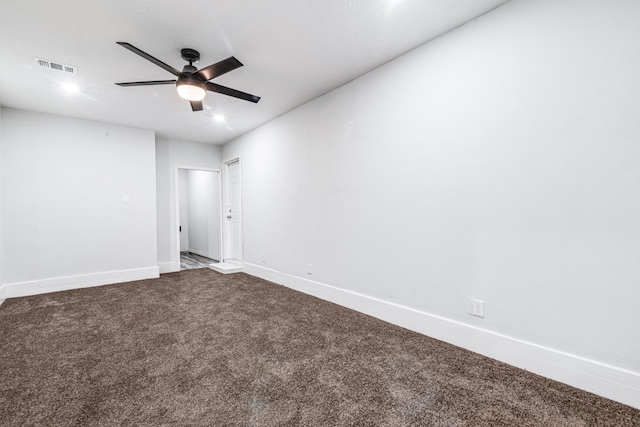 2821 1st Ave N, Texas City, TX 77590 - empty room featuring baseboards, visible vents, a ceiling fan, and dark colored carpet