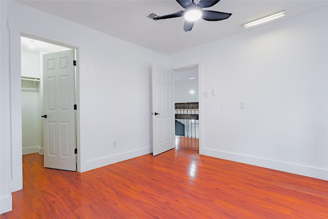 2902 Misty Park Dr, Houston, TX 77082 - empty room featuring wood finished floors, a ceiling fan, and baseboards