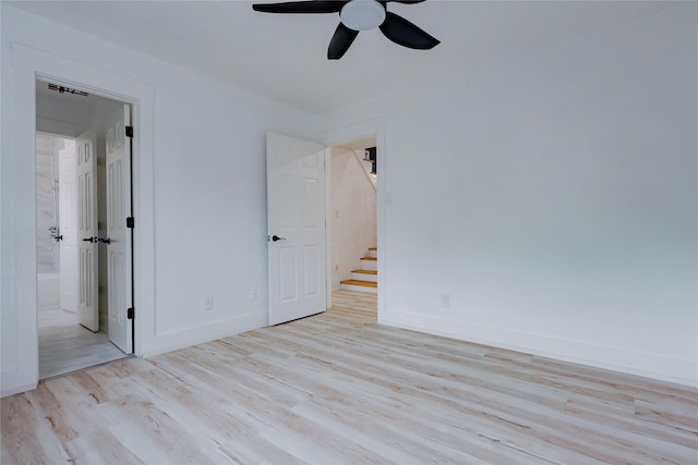 2902 Misty Park Dr, Houston, TX 77082 - unfurnished bedroom with wood finished floors, ensuite bath, baseboards, and a ceiling fan
