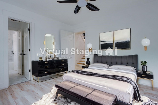 2902 Misty Park Dr, Houston, TX 77082 - bedroom with light wood-style floors, a ceiling fan, connected bathroom, and baseboards