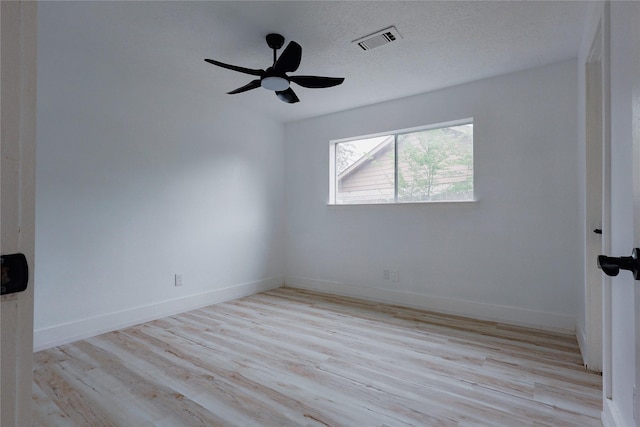2902 Misty Park Dr, Houston, TX 77082 - empty room featuring light wood finished floors, ceiling fan, and baseboards