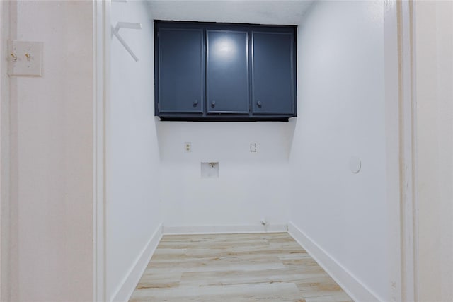 2902 Misty Park Dr, Houston, TX 77082 - laundry area featuring hookup for a washing machine, cabinet space, light wood-type flooring, and baseboards