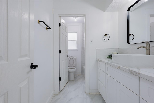 2902 Misty Park Dr, Houston, TX 77082 - bathroom featuring vanity, marble finish flooring, toilet, and baseboards