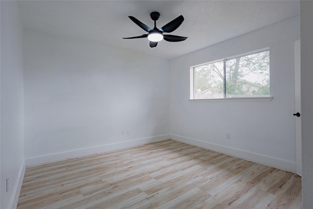 2902 Misty Park Dr, Houston, TX 77082 - unfurnished room with wood finished floors, baseboards, and a ceiling fan