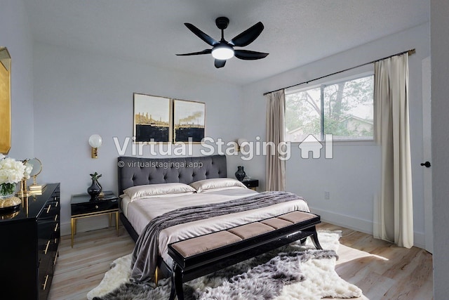 2902 Misty Park Dr, Houston, TX 77082 - bedroom featuring light wood-style flooring, baseboards, and ceiling fan