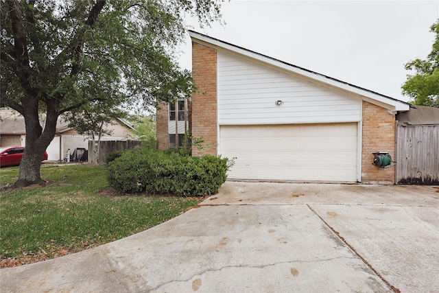 2902 Misty Park Dr, Houston, TX 77082 - view of side of home with driveway, brick siding, and an attached garage