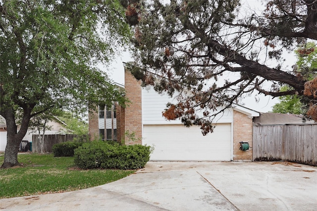 2902 Misty Park Dr, Houston, TX 77082 - view of property exterior featuring concrete driveway, brick siding, and an attached garage