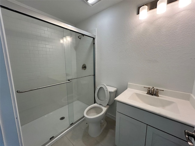6215 Amberwood Dr, League City, TX 77573 - full bath featuring a shower stall, vanity, tile patterned floors, and a textured wall