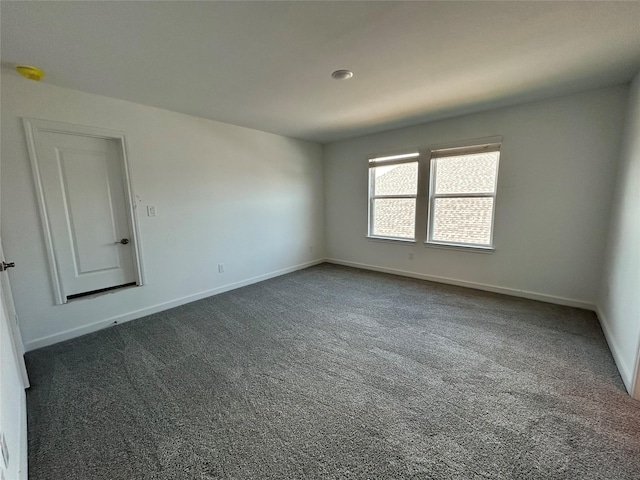 6215 Amberwood Dr, League City, TX 77573 - empty room featuring dark carpet and baseboards