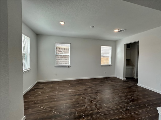 6215 Amberwood Dr, League City, TX 77573 - unfurnished room with wood tiled floors, healthy amount of natural light, and recessed lighting
