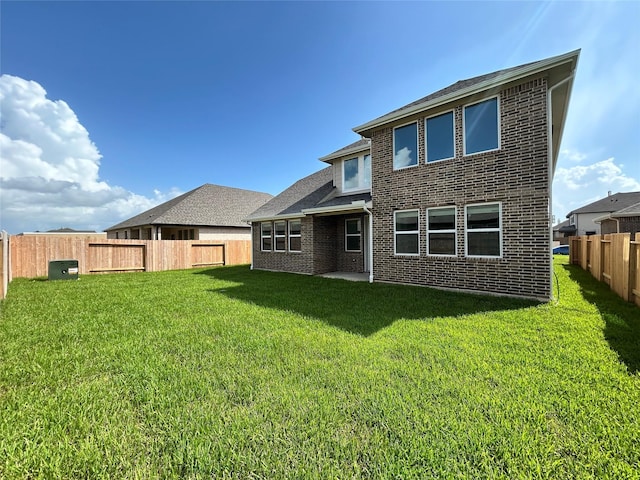 6215 Amberwood Dr, League City, TX 77573 - rear view of property featuring a fenced backyard and brick siding