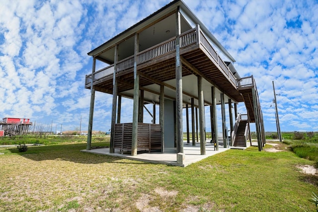 1391 Mabry St, Gilchrist, TX 77617 - exterior space with a patio area, stairway, and a yard