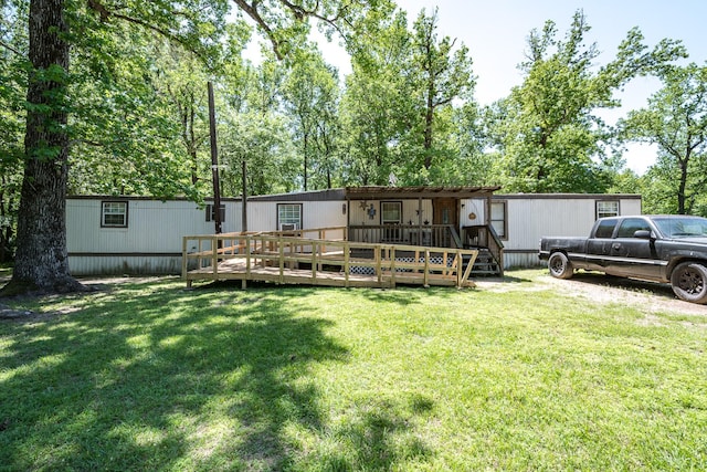 25528 Ipes Rd, Splendora, TX 77372 - back of house with a yard and a wooden deck