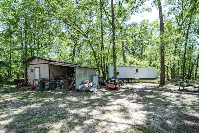 25528 Ipes Rd, Splendora, TX 77372 - exterior space featuring an outbuilding