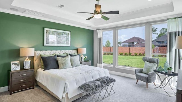 1536 River Point Dr, Friendswood, TX 77546 - carpeted bedroom with a tray ceiling, crown molding, multiple windows, and baseboards