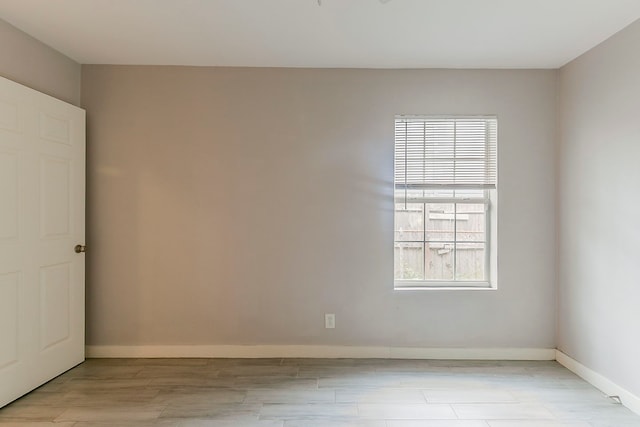 5009 Bataan Rd, Houston, TX 77033 - unfurnished room featuring baseboards and light wood finished floors