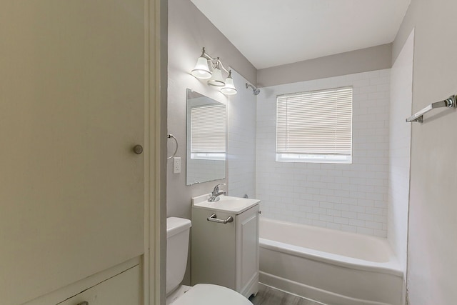 5009 Bataan Rd, Houston, TX 77033 - bathroom featuring toilet, vanity, and bathtub / shower combination