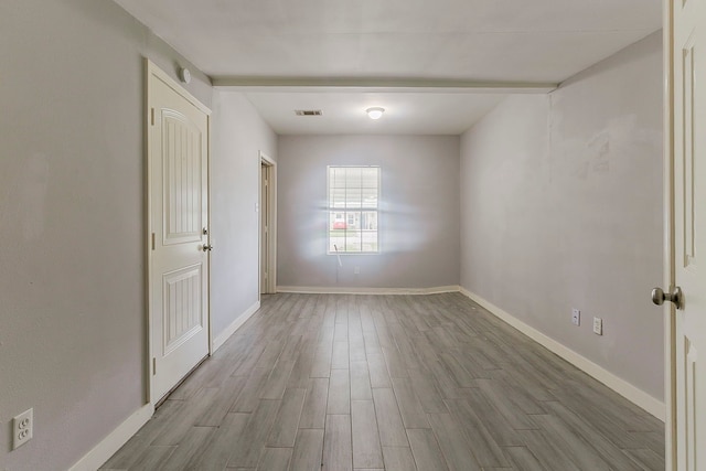 5009 Bataan Rd, Houston, TX 77033 - empty room featuring baseboards, visible vents, and wood finished floors