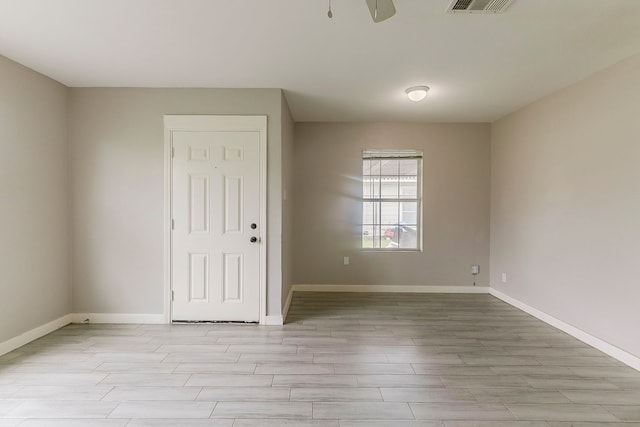 5009 Bataan Rd, Houston, TX 77033 - unfurnished room featuring baseboards, visible vents, and light wood-style floors