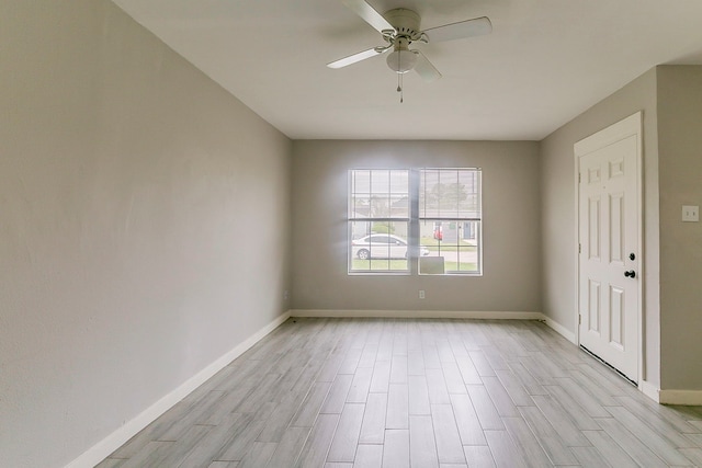 5009 Bataan Rd, Houston, TX 77033 - spare room with light wood finished floors, baseboards, and a ceiling fan