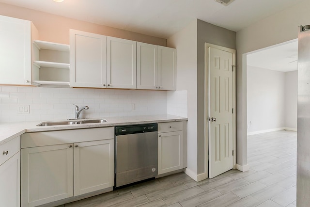5009 Bataan Rd, Houston, TX 77033 - kitchen with light countertops, a sink, open shelves, dishwasher, and decorative backsplash