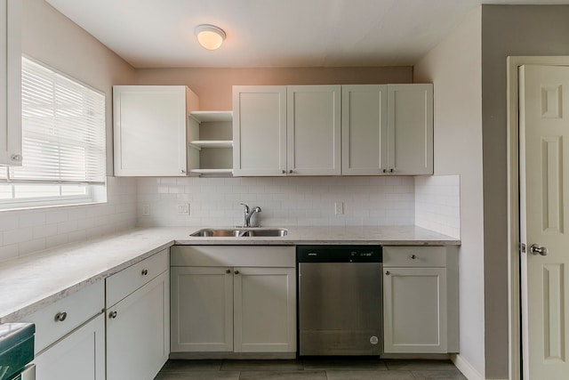 5009 Bataan Rd, Houston, TX 77033 - kitchen featuring light countertops, backsplash, open shelves, stainless steel dishwasher, and white cabinets