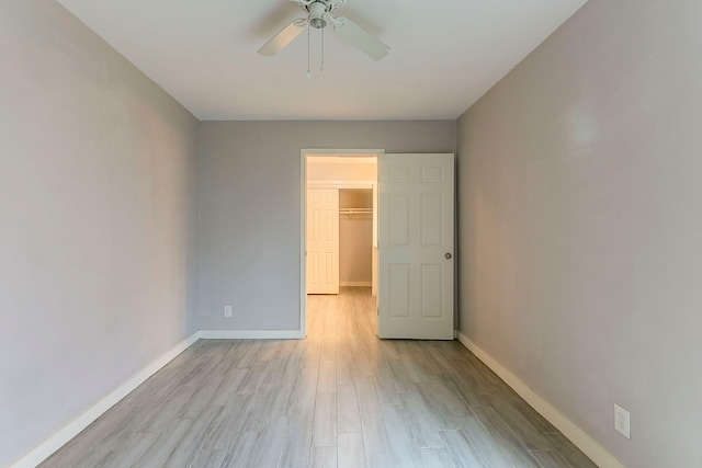 5009 Bataan Rd, Houston, TX 77033 - empty room with baseboards, ceiling fan, and light wood-style floors