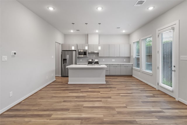 kitchen featuring recessed lighting, stainless steel appliances, visible vents, and light countertops