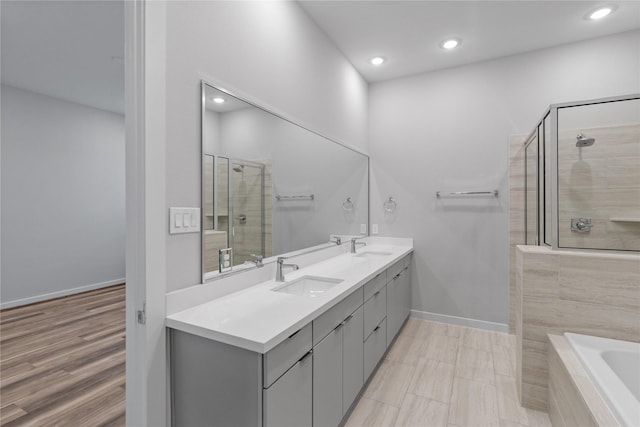 602 Thornton Rd Unit D, Houston, TX 77018 - full bath with a shower stall, recessed lighting, baseboards, tiled bath, and double vanity