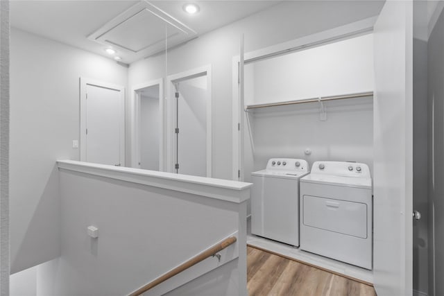 laundry area with attic access, separate washer and dryer, light wood-style flooring, laundry area, and recessed lighting