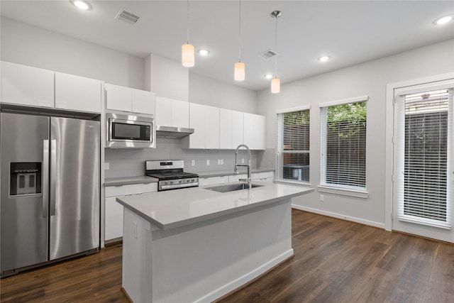 602 Thornton Rd Unit D, Houston, TX 77018 - kitchen with stainless steel appliances, a sink, under cabinet range hood, white cabinetry, and dark wood-style flooring