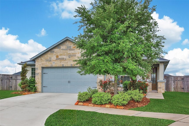 29026 Zacate Creek Ln, Fulshear, TX 77441 - view of front of home featuring stone siding, driveway, and an attached garage