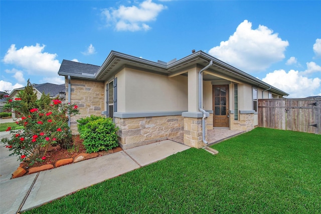 29026 Zacate Creek Ln, Fulshear, TX 77441 - view of property exterior featuring stone siding and stucco siding