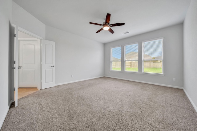 29026 Zacate Creek Ln, Fulshear, TX 77441 - spare room with carpet flooring, ceiling fan, and baseboards