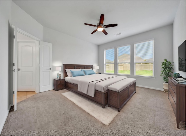 29026 Zacate Creek Ln, Fulshear, TX 77441 - bedroom with light colored carpet, baseboards, and ceiling fan