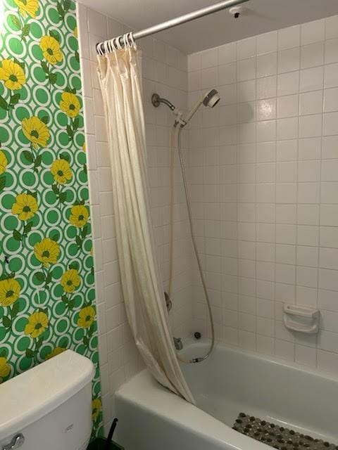 12600 Melville Dr Unit 214A, Montgomery, TX 77356 - bathroom featuring toilet and shower / tub combo