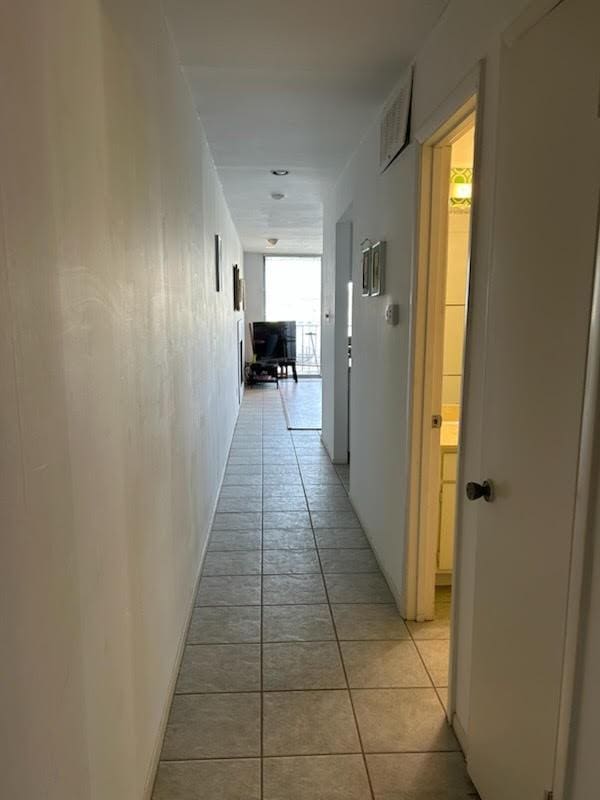 12600 Melville Dr Unit 214A, Montgomery, TX 77356 - hall with light tile patterned floors and visible vents