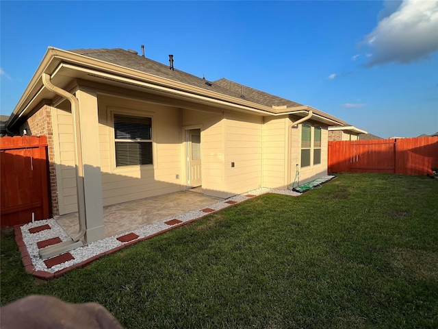 2923 Painted Sunrise Trl, Houston, TX 77045 - rear view of property with a lawn, a fenced backyard, and a patio