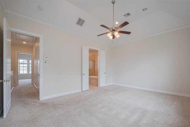 unfurnished bedroom featuring visible vents, attic access, ornamental molding, and light colored carpet
