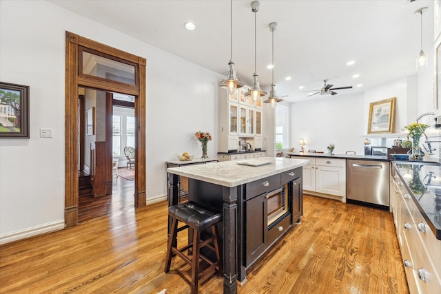 1101 Heights Blvd, Houston, TX 77008 - kitchen featuring dishwasher, white cabinets, light wood-style floors, ceiling fan, and recessed lighting