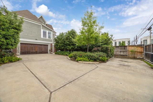 1101 Heights Blvd, Houston, TX 77008 - view of side of property with concrete driveway and an attached garage